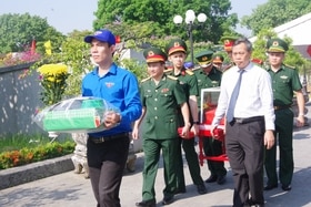 Tổ chức trang trọng Lễ truy điệu và an táng 9 hài cốt liệt sĩ quân tình nguyện Việt Nam hy sinh tại Lào