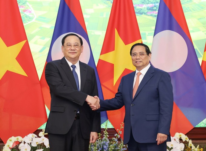 Thủ tướng Phạm Minh Chính tiếp Thủ tướng Lào Sonexay Siphandone (trái) vào ngày 22/4 tại Hà Nội. Ảnh: Giang Huy