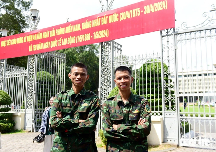 The two boys 'march' on foot to the Independence Palace on April 30