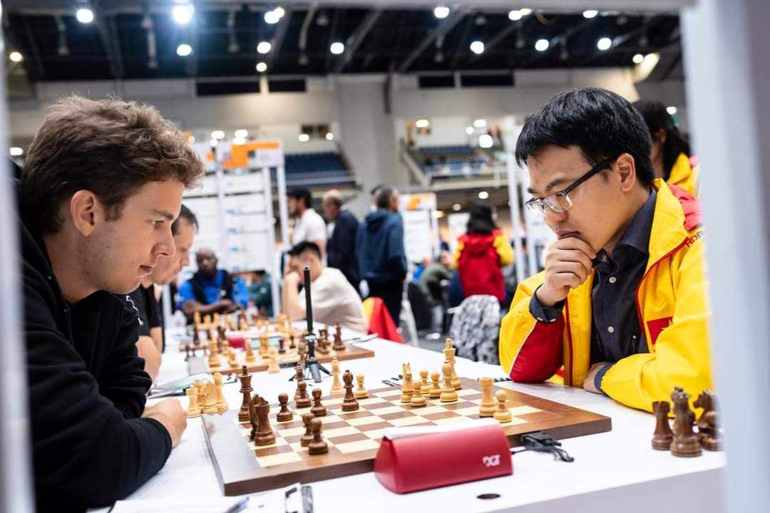 Tiếp mạch thắng, Lê Quang Liêm cùng đội tuyển cờ vua Việt Nam 'bay cao' ở Olympiad- Ảnh 2. Tiếp mạch thắng, Lê Quang Liêm cùng đội tuyển cờ vua Việt Nam 'bay cao' ở Olympiad- Ảnh 2.